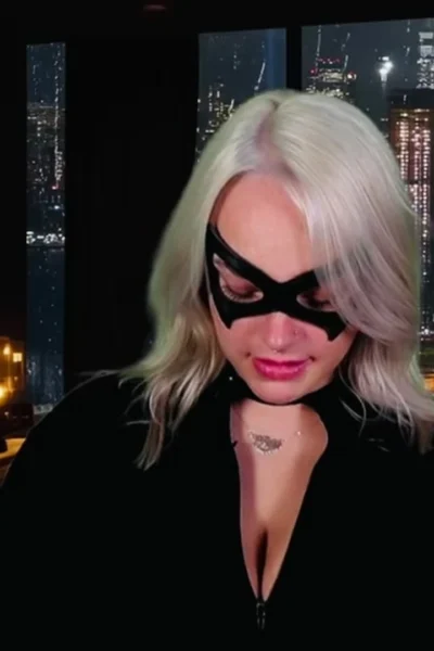 cat woman Whiptrax plays with her huge tits